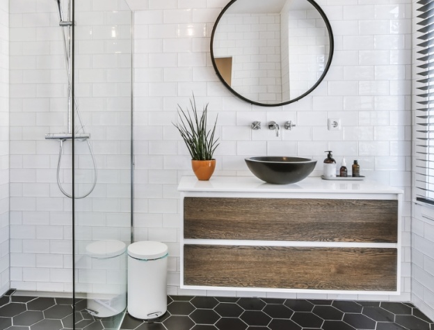 Lifestyle image of a wall hung washbasin unit with walnut brown drawers